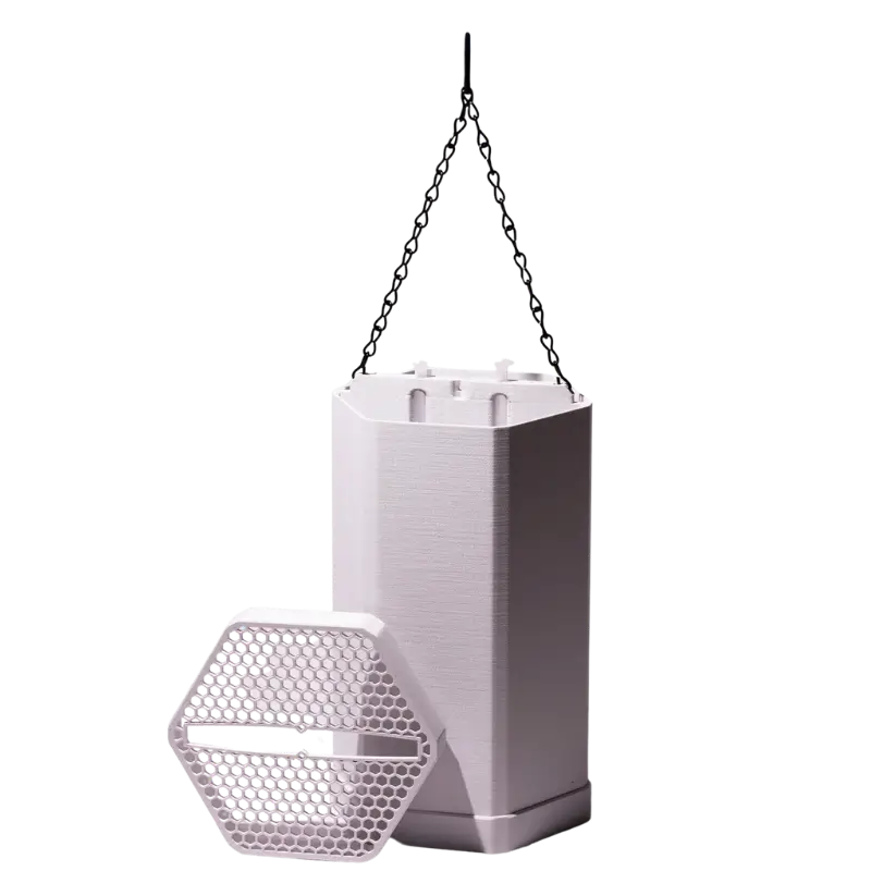 White hexagonal ScoutStop device with a honeycomb-patterned cover and hanging chain displayed on a transparent background.